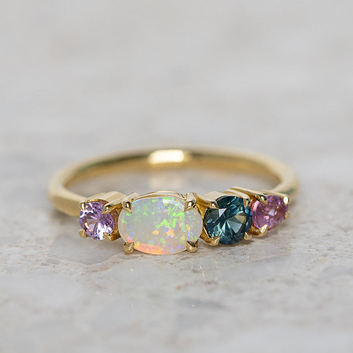 Gold with opal outlets ring